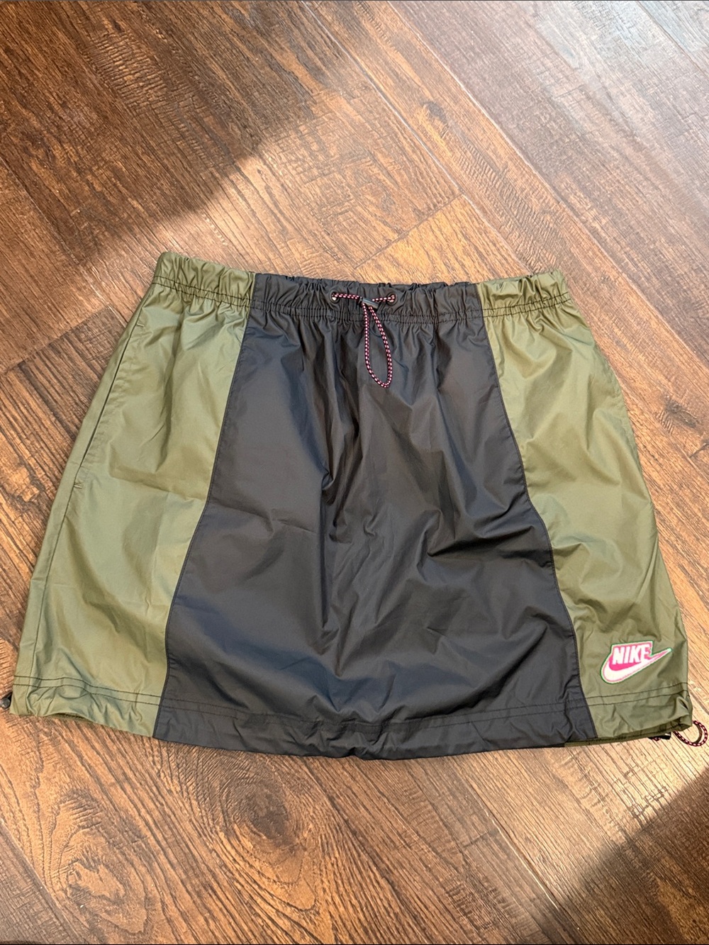 Nike women’s Olive Green and Black Athletic Skirt with Pink Nike Patch